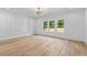 Bedroom with hardwood floors, decorative light fixture and large windows at 400 Auburn Rd, Auburn, GA 30011