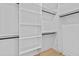 Spacious walk-in closet with custom shelving and organization system at 400 Auburn Rd, Auburn, GA 30011