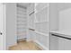 Walk-in closet with built-in shelving and organization systems at 400 Auburn Rd, Auburn, GA 30011