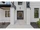 The front entrance features a double door, tile, and classic brick pillars at 400 Auburn Rd, Auburn, GA 30011