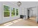 Flex room with hardwood floors, black cabinets, and large windows with a treed view at 400 Auburn Rd, Auburn, GA 30011