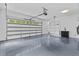 Spacious garage features epoxy flooring, ample shelving and sink at 400 Auburn Rd, Auburn, GA 30011