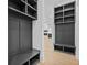 Hallway with custom built-in storage units and a glimpse of the open-concept interior at 400 Auburn Rd, Auburn, GA 30011
