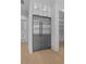 Modern stainless steel refrigerator surrounded by white cabinets and shelving in a brightly lit kitchen space at 400 Auburn Rd, Auburn, GA 30011