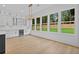 Bright kitchen with large windows showcasing a scenic backyard at 400 Auburn Rd, Auburn, GA 30011