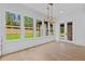 Bright, airy kitchen area with windows that show a beautifully landscaped backyard at 400 Auburn Rd, Auburn, GA 30011