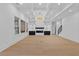 Spacious living room with hardwood floors, coffered ceilings, modern fireplace, and recessed lighting at 400 Auburn Rd, Auburn, GA 30011