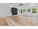 Bright living room with hardwood floors, fireplace, and large windows at 400 Auburn Rd, Auburn, GA 30011