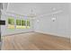 Bright and spacious living room with large windows, modern lighting, and stylish wall paneling at 400 Auburn Rd, Auburn, GA 30011