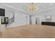 Bright living area features hardwood floors, recessed lighting, and an open floorplan at 400 Auburn Rd, Auburn, GA 30011