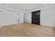 Open living space with a modern fireplace, bright windows, and stylish light fixtures at 400 Auburn Rd, Auburn, GA 30011