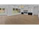 Bright living room features hardwood floors, modern fireplace, and lots of natural light at 400 Auburn Rd, Auburn, GA 30011