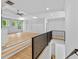 Bright living room with hardwood floors, tray ceiling, and large windows at 400 Auburn Rd, Auburn, GA 30011