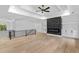 Bright living room with hardwood floors, fireplace, and iron railing at 400 Auburn Rd, Auburn, GA 30011