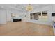 Open concept living room with hardwood floors, recessed lighting, and open to kitchen area at 400 Auburn Rd, Auburn, GA 30011