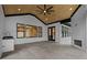Covered outdoor living space with a fireplace, stainless steel sink, and view of the yard at 400 Auburn Rd, Auburn, GA 30011