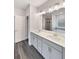 Bathroom featuring a double vanity, undermount sinks, and a large mirror at 5331 Tuscany Dr, Douglasville, GA 30135