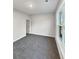 A bright bedroom features a large window and plush gray carpeting, a tranquil retreat at 5331 Tuscany Dr, Douglasville, GA 30135