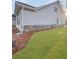 A home with grey siding, brick accents, and a well manicured lawn at 5331 Tuscany Dr, Douglasville, GA 30135
