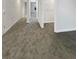 A spacious hallway showcases neutral walls, plush gray carpeting, and ample natural light at 5331 Tuscany Dr, Douglasville, GA 30135