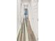 Hallway with wood-look floors and white doors at 5331 Tuscany Dr, Douglasville, GA 30135