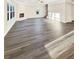 A spacious living room features a fireplace, large windows, and hardwood flooring at 5331 Tuscany Dr, Douglasville, GA 30135