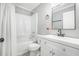 This bathroom has patterned floors, a shower and tub combo, and a white vanity at 581 Taylor Se Dr, Smyrna, GA 30080