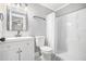 Bright bathroom features patterned tile floors, a shower with white tile, and a sleek vanity at 581 Taylor Se Dr, Smyrna, GA 30080