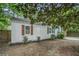 Exterior shows a home with updated siding, wood shutters, landscaping, and a bright front door at 581 Taylor Se Dr, Smyrna, GA 30080