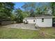 Rear exterior view of home with backyard, patio and parking at 581 Taylor Se Dr, Smyrna, GA 30080