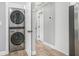 Hallway features stacked washer dryer and an open doorway leading to other rooms at 581 Taylor Se Dr, Smyrna, GA 30080