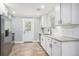 Modern kitchen featuring stainless steel appliances and white cabinets with dark hardware at 581 Taylor Se Dr, Smyrna, GA 30080
