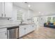 Contemporary kitchen with stainless steel dishwasher and sink, bright cabinets, and open layout at 581 Taylor Se Dr, Smyrna, GA 30080