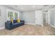 Spacious living room with wood floors, bright windows, and modern lighting at 581 Taylor Se Dr, Smyrna, GA 30080