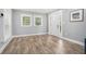 Bright living room with wood floors, white trim, and a modern, neutral color scheme at 581 Taylor Se Dr, Smyrna, GA 30080