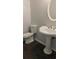 Powder room featuring a decorative sink and tile flooring at 162 Odyssey Turn, Conyers, GA 30012