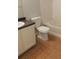 Bathroom featuring a tile floor, a tiled shower and a white cabinet and sink at 162 Odyssey Turn, Conyers, GA 30012
