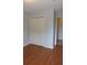 Bedroom features light gray walls, wood floor, and a double door closet at 162 Odyssey Turn, Conyers, GA 30012