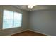 Bedroom with wood floor, ceiling fan and a window to let the sunshine in at 162 Odyssey Turn, Conyers, GA 30012