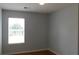 Cozy bedroom with hardwood floors with a sunny window and neutral paint at 162 Odyssey Turn, Conyers, GA 30012