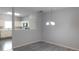 Open dining area next to kitchen provides extra seating at 162 Odyssey Turn, Conyers, GA 30012