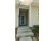 Close up of the front entryway of the townhome featuring a black front door at 162 Odyssey Turn, Conyers, GA 30012