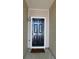 Townhome entryway features a stylish black door, natural light, and a welcoming mat at 162 Odyssey Turn, Conyers, GA 30012