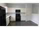 Clean kitchen has white cabinets and ample counter space at 162 Odyssey Turn, Conyers, GA 30012