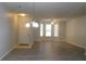 Bright living room features hardwood floors and lots of windows at 162 Odyssey Turn, Conyers, GA 30012