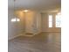Open living area features hardwood floors and entry door at 162 Odyssey Turn, Conyers, GA 30012