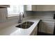 The kitchen features a stainless steel sink with a window at 162 Odyssey Turn, Conyers, GA 30012