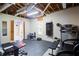 Unfinished basement gym space equipped with various workout machines and exposed ceiling at 1812 Riverton Dr, Suwanee, GA 30024