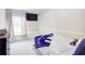 Cozy bedroom with comfortable bed, window seat, and built-in television at 1812 Riverton Dr, Suwanee, GA 30024