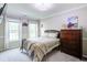 Bedroom with hardwood floors, neutral paint, a ceiling fan and ample sunlight at 1812 Riverton Dr, Suwanee, GA 30024